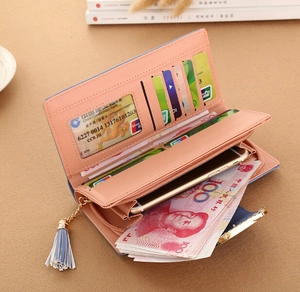 Pink orange leather wallet with tassel detail showing multi-card slots and phone holder