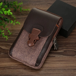 Detail of dark brown leather phone pouch with plastic buckle and secure metal zipper