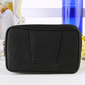 Detail of black nylon phone waist bag with wide belt loops and textured fabric
