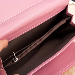 Detail view of pink PU leather wallet interior with organ multi-layer compartments