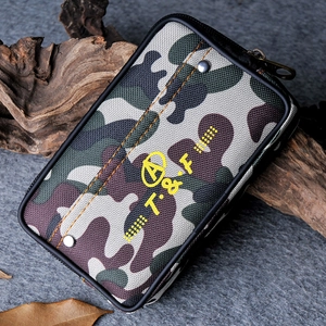 Close-up of durable camo canvas waist bag with yellow logo and metal rivet details