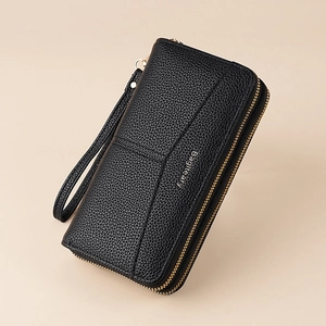 Detail of black pebbled leather double zipper wallet with wrist strap and brand logo
