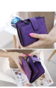 Close-up of purple matte wallet interior with multiple card slots and zipper pocket