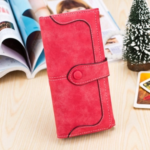 Close-up of red frosted suede long wallet with wave stitching and snap closure