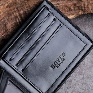 Close-up of black leather wallet interior featuring card slots and BOVI'S brand embossing