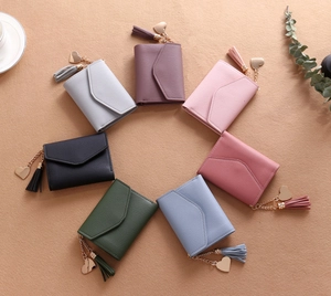 Short leather wallets with litchi texture featuring tassel and heart pendants in seven colors