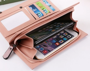Detailed interior of a pink frosted faux leather clutch showing phone slots and card holders