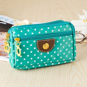 Three-layer canvas mobile phone bag with white polka dots on a blue-green background