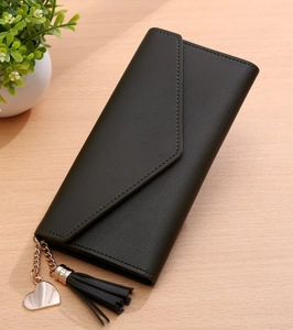 Elegant black envelope wallet for women featuring a heart pendant and chic tassel detail