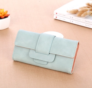 Detail of mint blue long wallet featuring lychee texture and pink edge finish