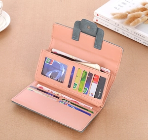 Detailed interior of a grey and pink long wallet featuring multiple card slots and cash compartment