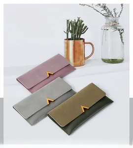 Detail of color-block frosted leather long wallets with golden V-shaped buckles