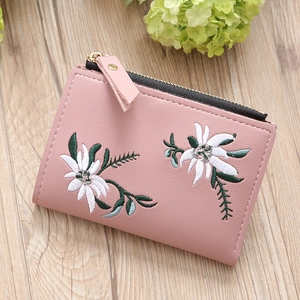 Pink PU leather short wallet with delicate daisy embroidery and gold zipper closure