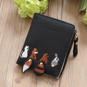 Black mini bifold wallet with cute animal embroidery on rustic wooden background