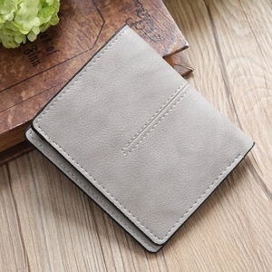 Light gray bifold faux leather wallet with lychee texture and decorative stitching