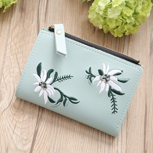Mini mint green student wallet with elegant white floral embroidery on pebbled faux leather