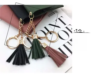 Mini PU leather tassel keychain with fold-over card holder in black, green, and pink colors