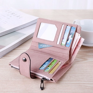 Interior view of pink frosted faux leather wallet with multiple card slots and zipper pocket