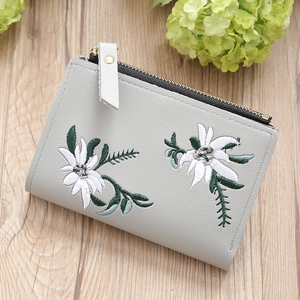 Short grey faux leather wallet for women with floral embroidery and gold zipper closure