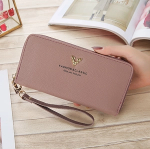 Dusty pink litchi pattern long wallet with gold deer emblem and wrist strap