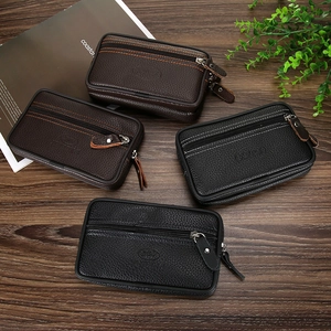 Close-up of leather waist bags in multiple colors featuring dual metal zippers and texture