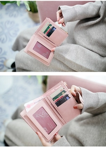 Interior detail of a pink folding wallet with multiple card slots and a zip coin pocket