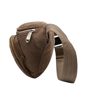 Detail view of durable oxford fabric texture and multi-layer zippers on men waist bag