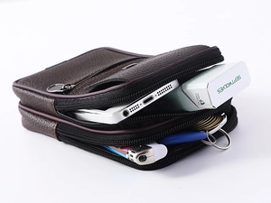 Vertical men's PU leather belt bag showing multi-pocket capacity for phone and essentials