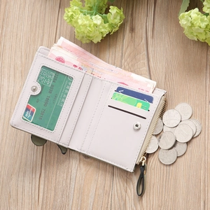 Detail of compact off-white wallet with card slots, coin pocket and bill compartment