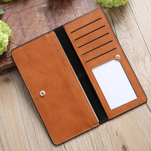 Brown leather wallet interior showing multiple card slots and metal snap closure