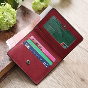 Interior detail of red lychee grain leather wallet showing card slots and ID window