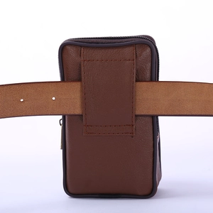 Brown leather vertical phone holster with double zippers and belt loop on white backdrop