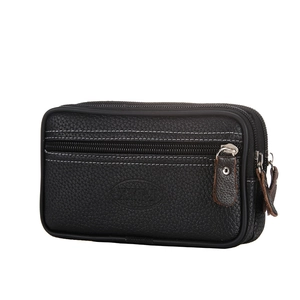 Detail view of black lychee leather waist bag featuring double zippers and white contrast stitching