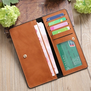 Detailed view of brown long wallet with multiple card slots and secure snap closure