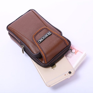 Detailed interior of brown leather belt pouch showing dual zippers and phone storage