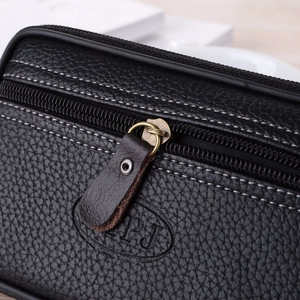 Close-up of embossed LPJ logo and contrast stitching on black leather waist bag
