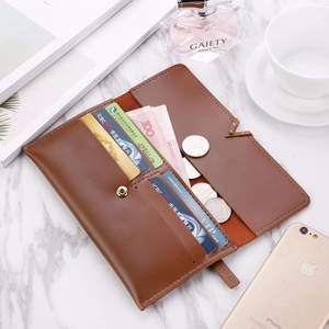 Brown long tri-fold wallet detail showing multiple card slots and cash storage capacity