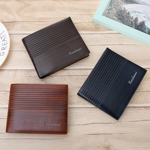 Three classic textured faux leather bifold wallets for men in brown and black