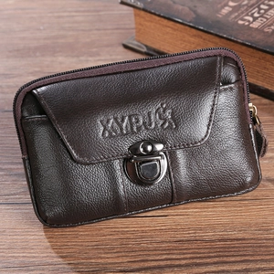 Dark brown leather belt pouch for 6.5 inch phones with metal lock on wooden desk
