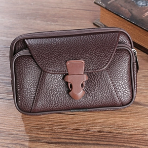 Brown litchi grain leather waist bag with multi-pocket design and plastic buckle closure
