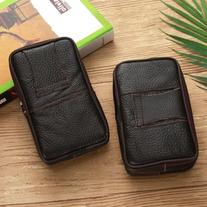 Detailed back view of dark brown litchi pattern leather belt loops on phone pouches