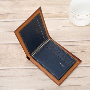 Detailed view of men's bifold wallet with contrast interior and multiple card slots