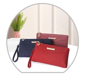 Detail of multi-color V-quilted faux leather wallets with wristlets and gold zippers