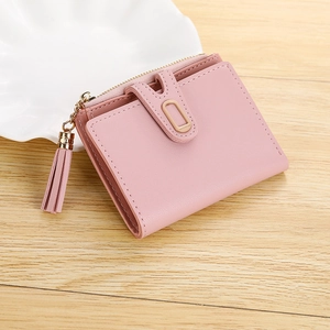 Pink faux leather short bi-fold wallet for women with tassel and gold hardware
