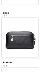 Detail view of the black lychee pattern leather handbag showing back zipper and stitching