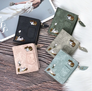 Detail of five bifold wallets with cat embroidery and denim texture in varied colors