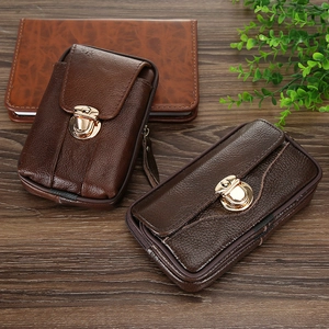Detailed view of horizontal and vertical brown faux leather waist bags on wood surface