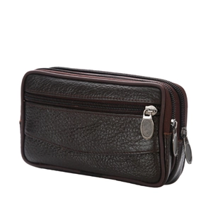 Detail view of the deep brown leather waist bag showing three layered zipper compartments