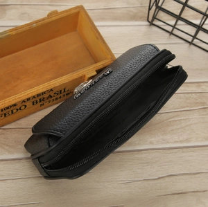 Macro view of black lychee grain PU leather waist bag with double zipper compartments