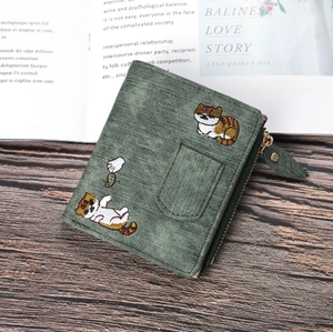 Detailed cat embroidery on dark green denim style wallet with leaf zipper and card slot